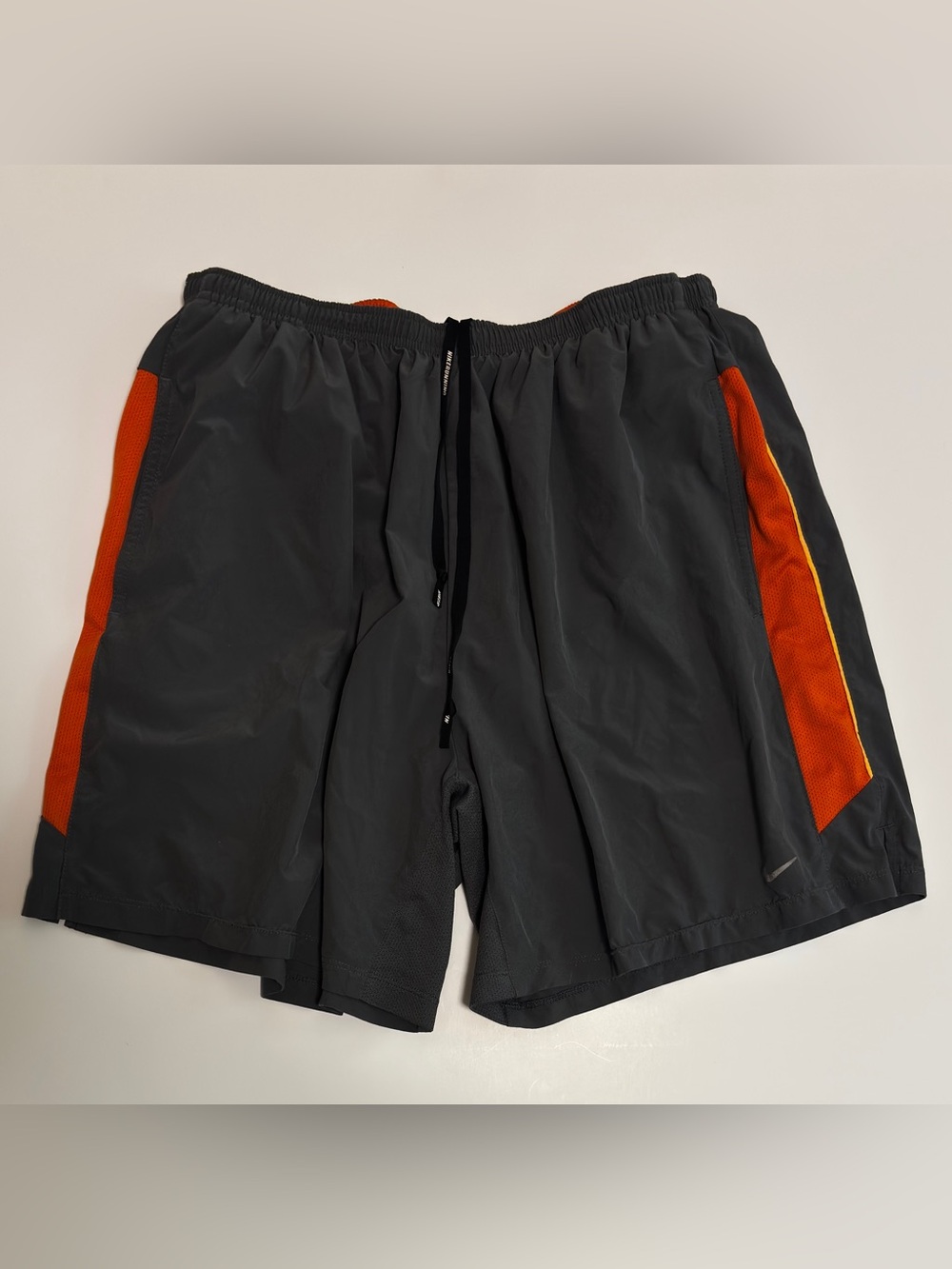Nike Men's Charcoal Athletic Shorts with Orange Panels